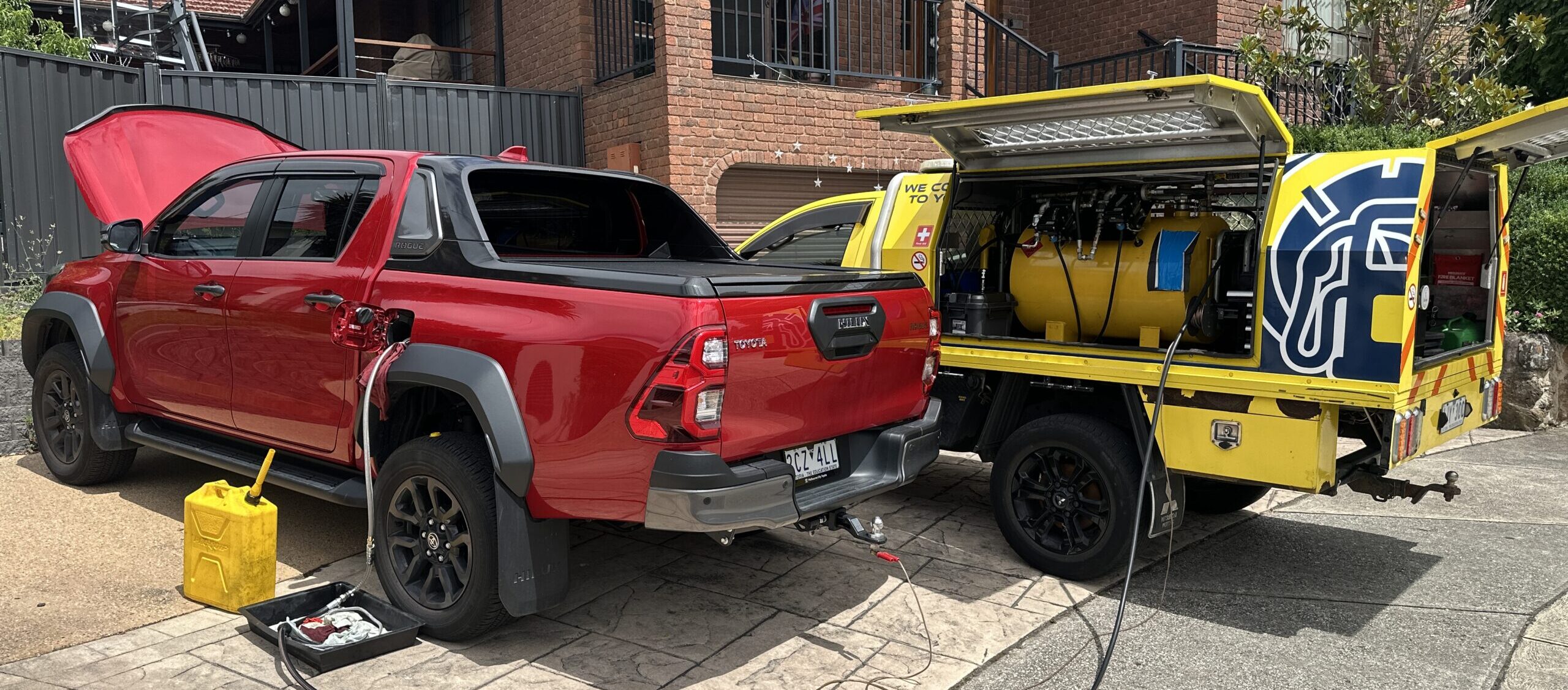 Petrol in diesel car Melbourne — Rapid Fuel Assist technician draining contaminated fuel on the spot