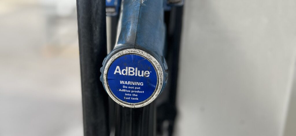 AdBlue warning label on fuel cap — do not put AdBlue into fuel tank