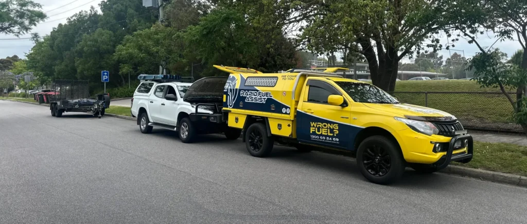 wrong fuel driving freeway Melbourne — Mitsubishi Triton towing trailer recovery Monash freeway