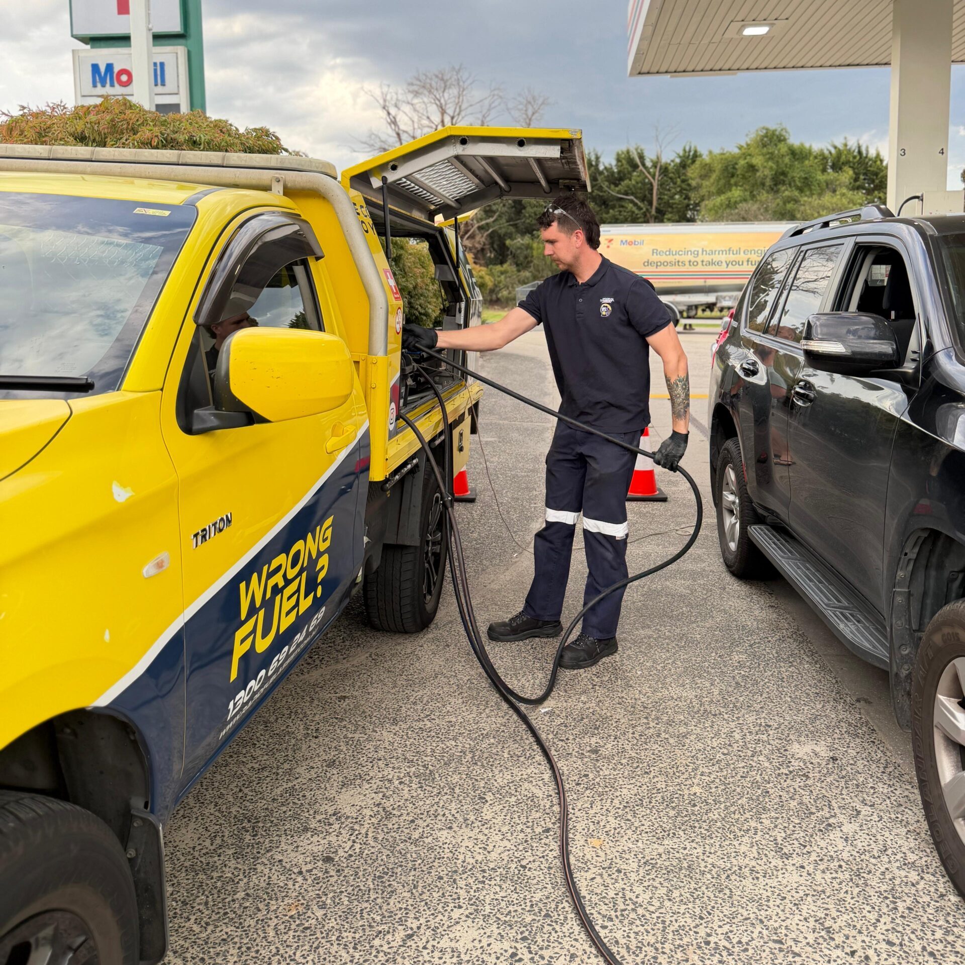 Rapid Fuel Assist technician draining wrong fuel on site — Indigenous Australian owned mobile wrong fuel rescue service Melbourne