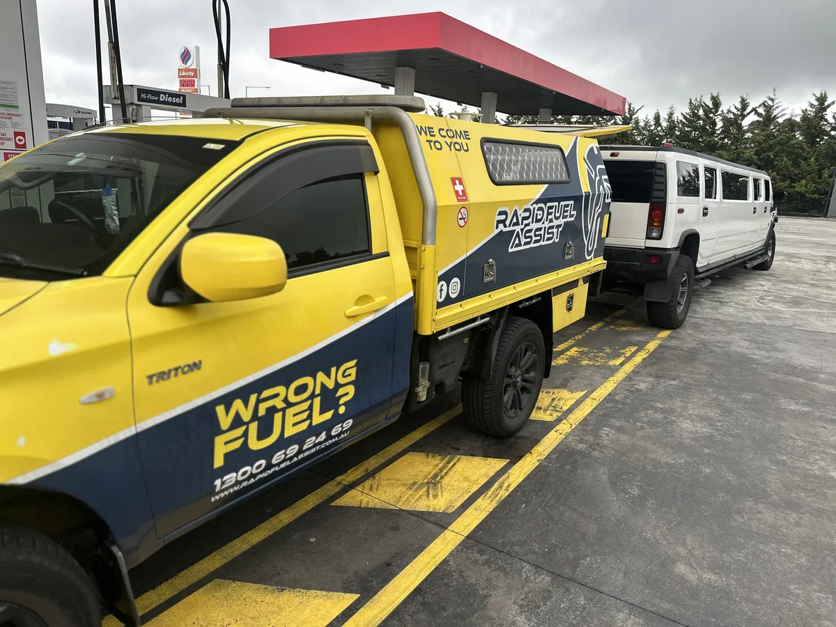 Rapid Fuel Assist service ute alongside a Hummer H2 stretch limo during a wrong fuel rescue in Greenvale, Melbourne