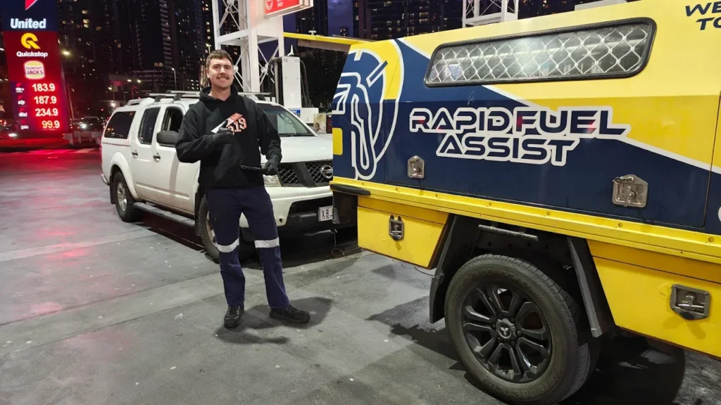 Rapid Fuel Assist technician beside a Nissan Navara after a petrol in diesel rescue at the United servo on Kings Way, South Melbourne