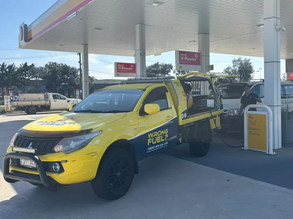Rapid Fuel Assist ute draining diesel from a petrol Toyota HiAce at a Shell servo in Seaford